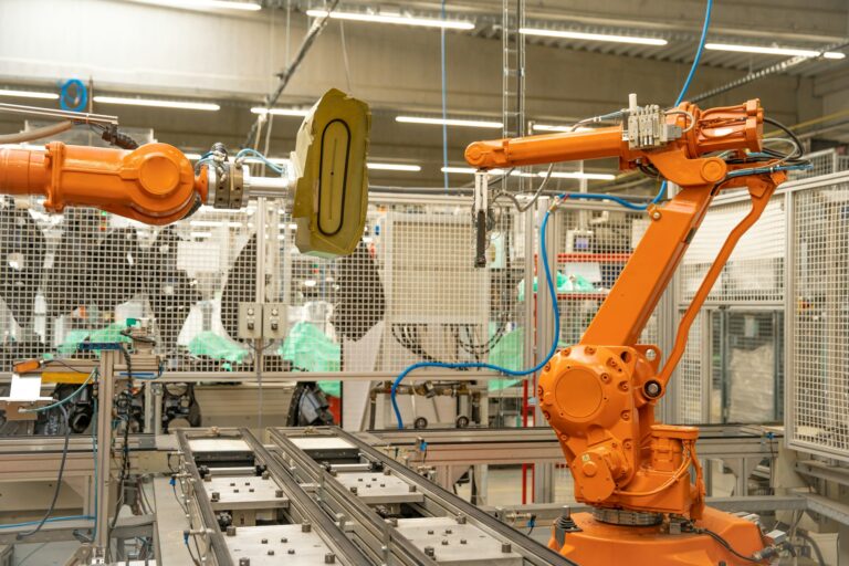 robot arms in the factory performs precise work according to the specified program